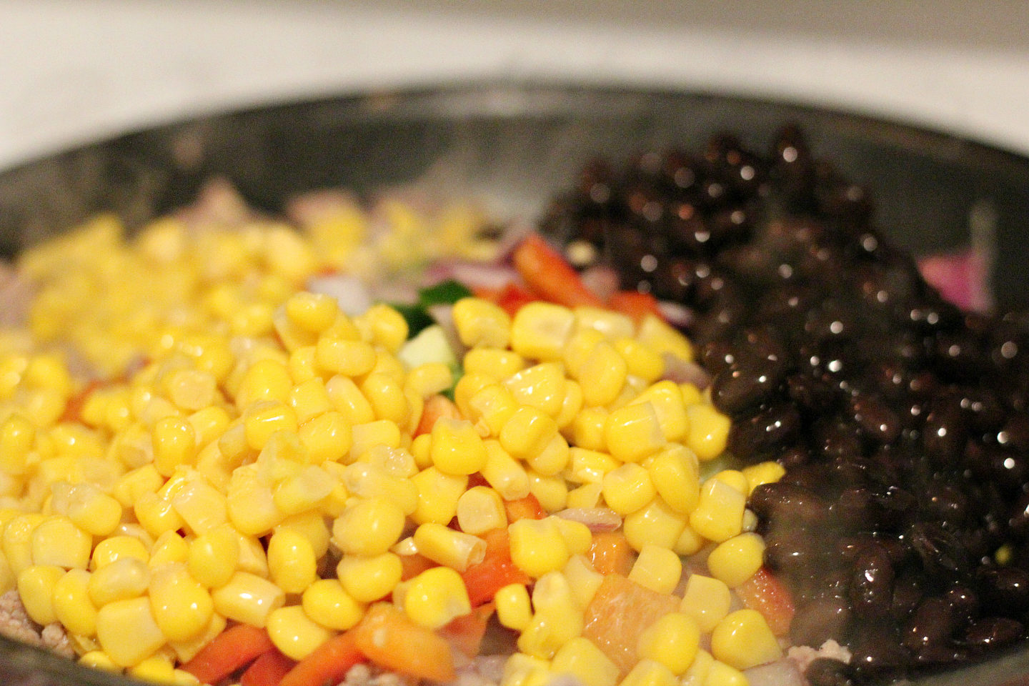 adding in corn and black beans